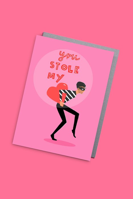 greeting card illustration of a man dress as a thief holding a heart. Funny and cute
